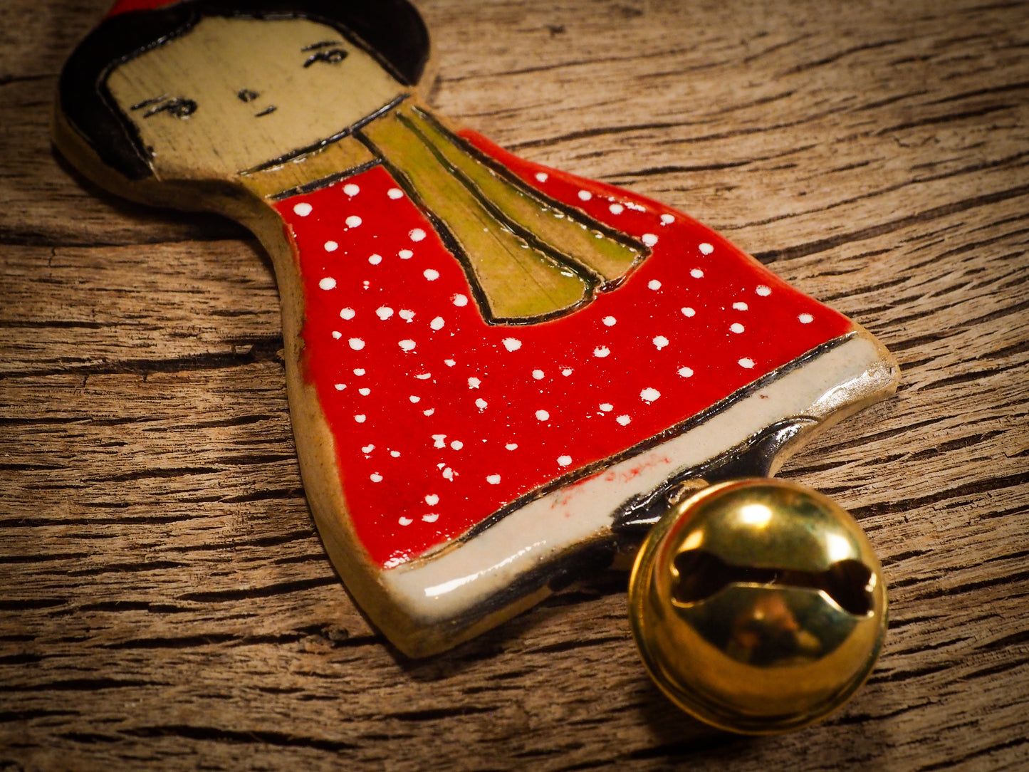 An original Christmas Holiday tree round glazed ceramic ornament handmade by Idania Salcido, the artist behind Danita Art. Glazed carved sgraffito stoneware, hand painted and decorated, it is illustrated by hand with snowmen, Christmas trees, Santa Claus, angels and snow balls and winter themes.