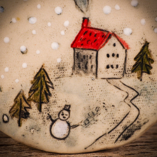 An original Christmas Holiday tree round glazed ceramic ornament handmade by Idania Salcido, the artist behind Danita Art. Glazed carved sgraffito stoneware, hand painted and decorated, it is illustrated by hand with winter scenes with snowmen, Christmas trees, Santa Claus, snow balls and winter themes.