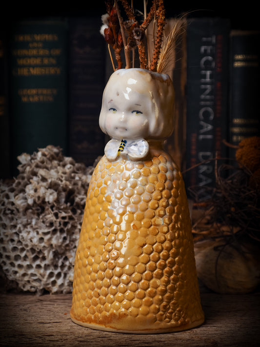 Original handmade ceramic flower vase, artist brush and pencil holder by Idania Salcido, Danita Art. A honeycomb bee shaped statue with china doll head. Handmade touch to any artist's studio with handmade glazed ceramic good for watercolors acrylics inks and oil paints. Clean with water or mineral spirits.