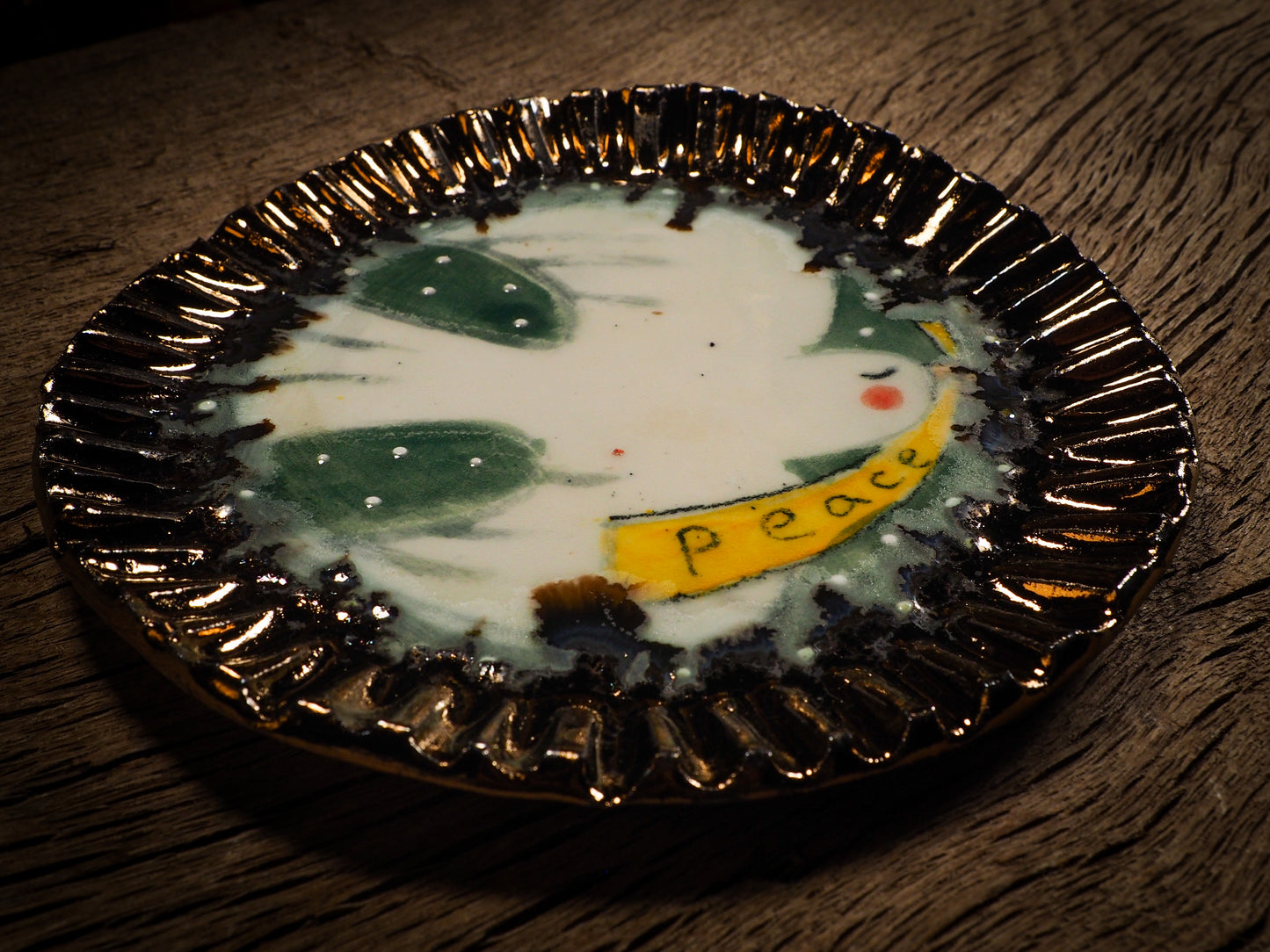 An original Christmas Holiday cake dinner dessert plate round glazed ceramic dinnerware handmade by Idania Salcido, the artist behind Danita Art. Glazed carved sgraffito stoneware, hand painted and decorated, it is illustrated by hand with snowmen, Christmas trees, Santa Claus, angels and snowballs and winter themes.