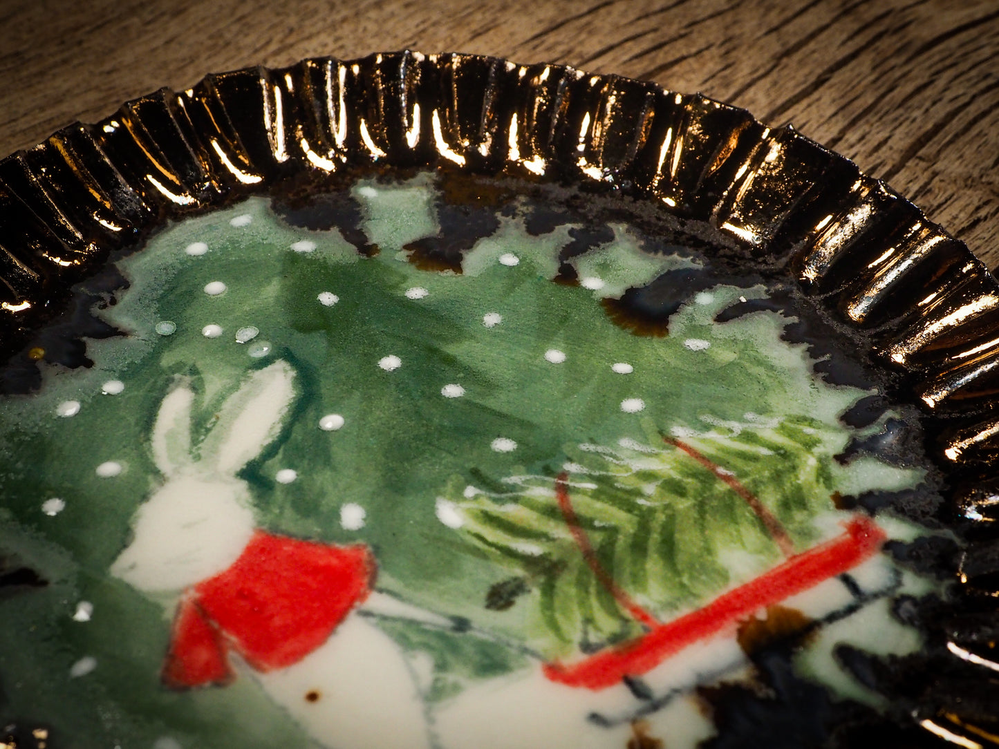 An original Christmas Holiday cake dinner dessert plate round glazed ceramic dinnerware handmade by Idania Salcido, the artist behind Danita Art. Glazed carved sgraffito stoneware, hand painted and decorated, it is illustrated by hand with snowmen, Christmas trees, Santa Claus, angels and snowballs and winter themes.