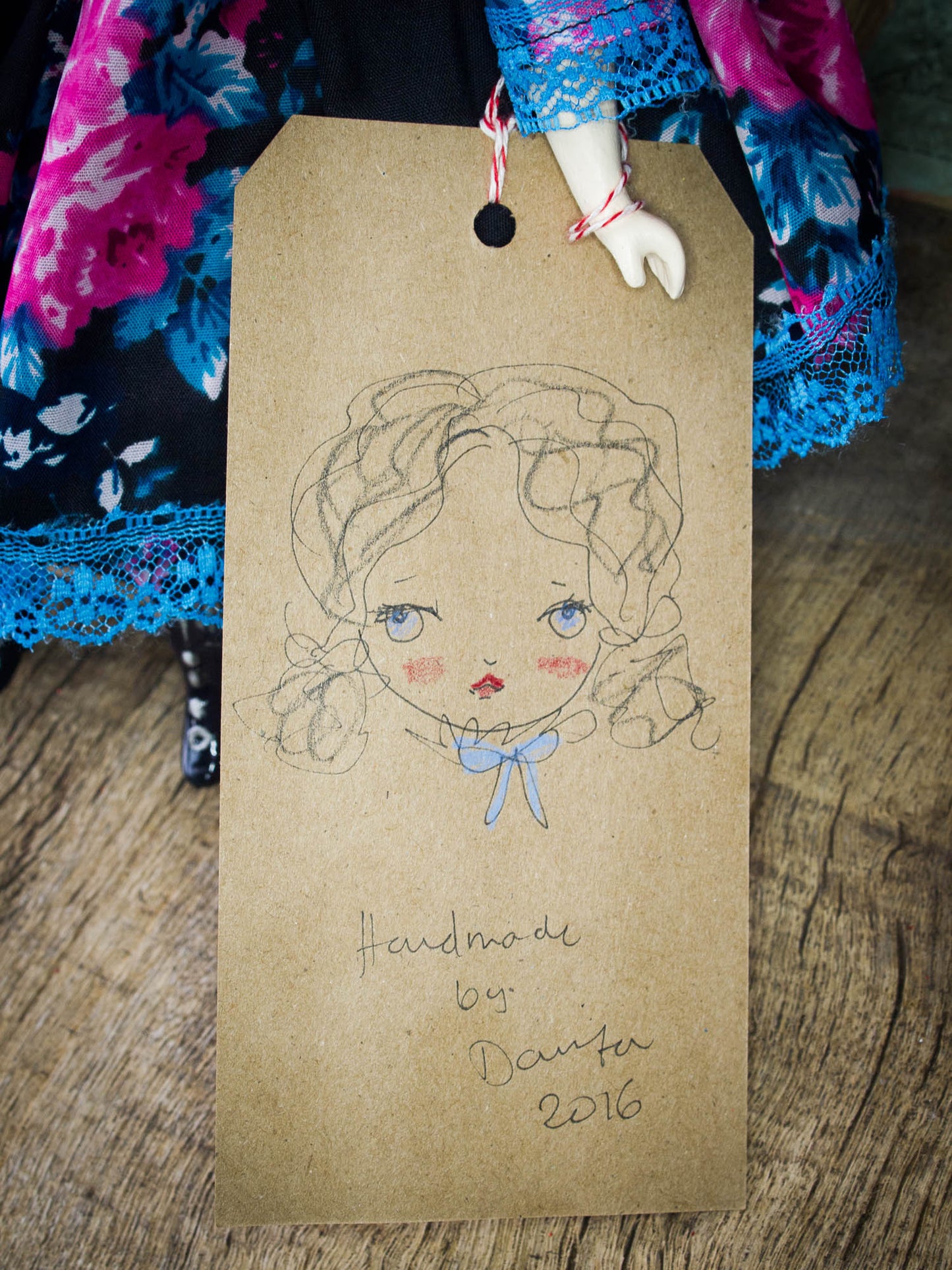 Pauline, a beautiful handmade art doll created by Danita Art with mixed media techniques, fabric and paper clay to create a sweet face with amazingly expressive blue eyes.