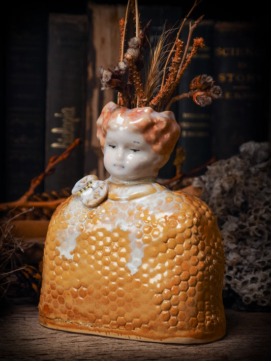 Original handmade ceramic flower vase, artist brush and pencil holder by Idania Salcido, Danita Art. A honeycomb bee shaped statue with china doll head. Handmade touch to any artist's studio with handmade glazed ceramic good for watercolors acrylics inks and oil paints. Clean with water or mineral spirits.