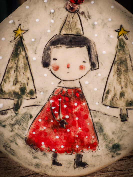 An original Christmas Holiday tree round glazed ceramic ornament handmade by Idania Salcido, the artist behind Danita Art. Glazed carved sgraffito stoneware, hand painted and decorated, it is illustrated by hand with winter scenes with snowmen, Christmas trees, Santa Claus, snow balls and winter themes.