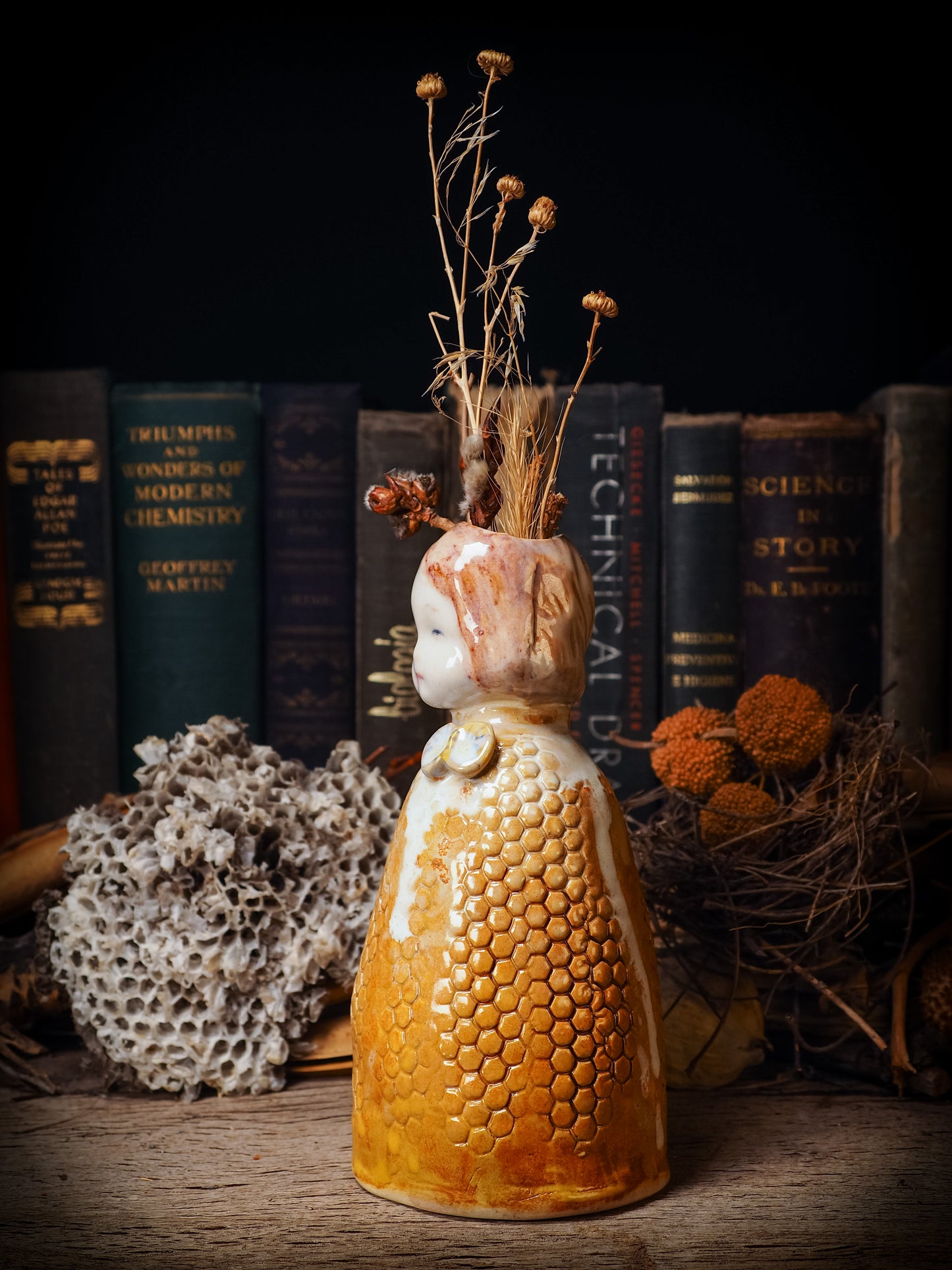 Original handmade ceramic flower vase, artist brush and pencil holder by Idania Salcido, Danita Art. A honeycomb bee shaped statue with china doll head. Handmade touch to any artist's studio with handmade glazed ceramic good for watercolors acrylics inks and oil paints. Clean with water or mineral spirits.