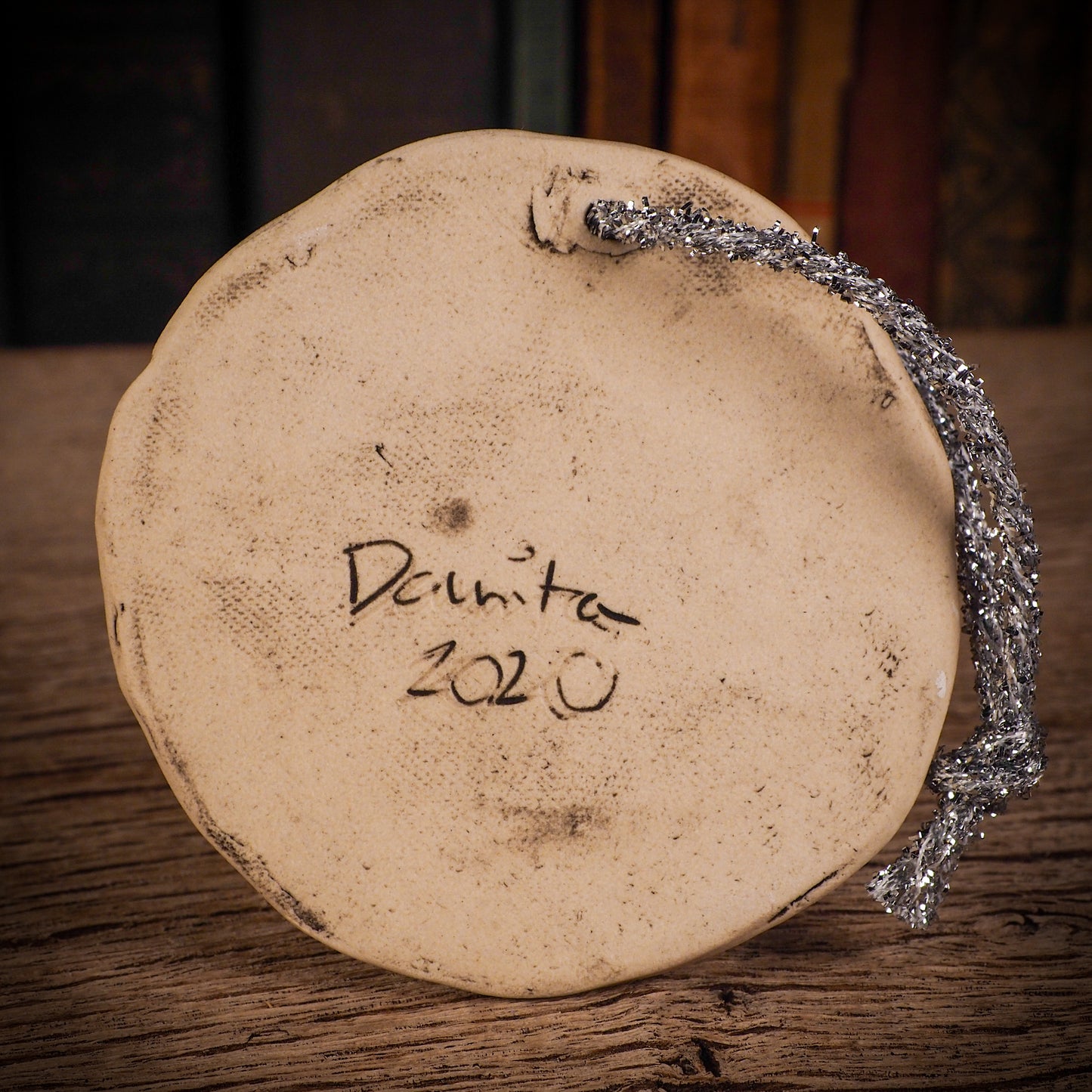 An original Christmas Holiday tree round glazed ceramic ornament handmade by Idania Salcido, the artist behind Danita Art. Glazed carved sgraffito stoneware, hand painted and decorated, it is illustrated by hand with winter scenes with snowmen, Christmas trees, Santa Claus, snow balls and winter themes.