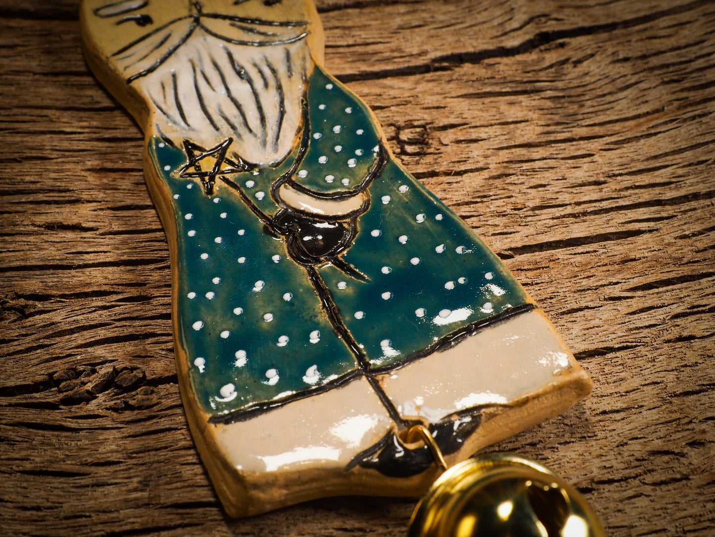 An original Christmas Holiday tree round glazed ceramic ornament handmade by Idania Salcido, the artist behind Danita Art. Glazed carved sgraffito stoneware, hand painted and decorated, it is illustrated by hand with snowmen, Christmas trees, Santa Claus, angels and snow balls and winter themes.