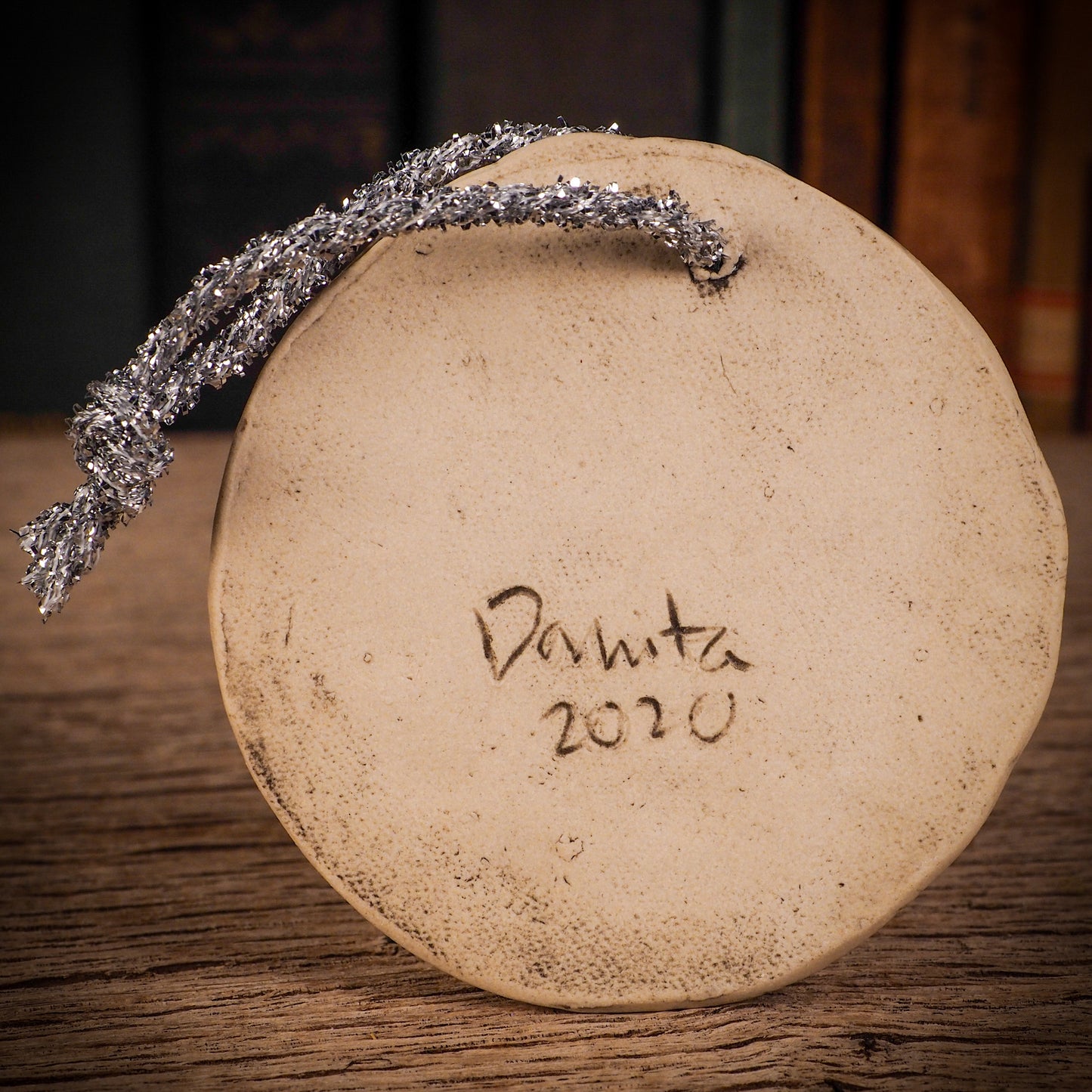 An original Christmas Holiday tree round glazed ceramic ornament handmade by Idania Salcido, the artist behind Danita Art. Glazed carved sgraffito stoneware, hand painted and decorated, it is illustrated by hand with winter scenes with snowmen, Christmas trees, Santa Claus, snow balls and winter themes.