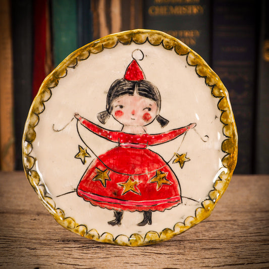 An original Christmas Holiday cake dinner plate round glazed ceramic dinnerware handmade by Idania Salcido, the artist behind Danita Art. Glazed carved sgraffito stoneware, hand painted and decorated, it is illustrated by hand with snowmen, Christmas trees, Santa Claus, angels and snow balls and winter themes.
