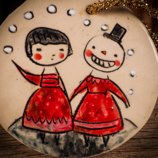 An original Christmas Holiday tree round glazed ceramic ornament handmade by Idania Salcido, the artist behind Danita Art. Glazed carved sgraffito stoneware, hand painted and decorated, it is illustrated by hand with winter scenes with snowmen, Christmas trees, Santa Claus, snow balls and winter themes.