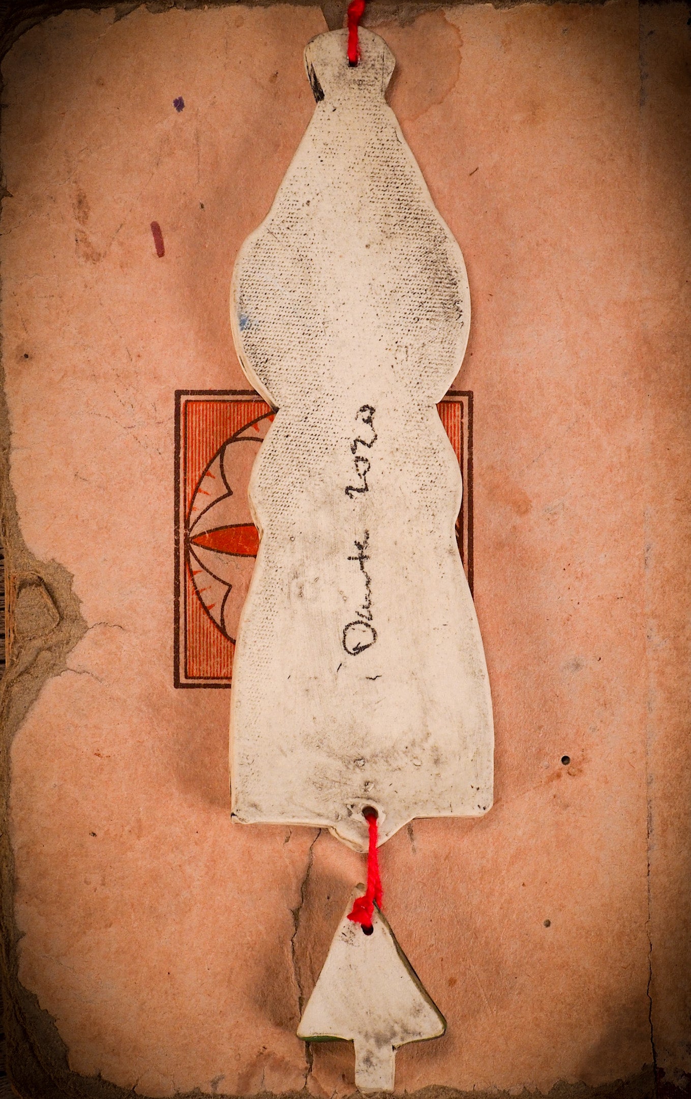 An original Christmas Holiday tree round glazed ceramic ornament handmade by Idania Salcido, the artist behind Danita Art. Glazed carved sgraffito stoneware, hand painted and decorated, it is illustrated by hand with snowmen, Christmas trees, Santa Claus, angels and snow balls and winter themes.