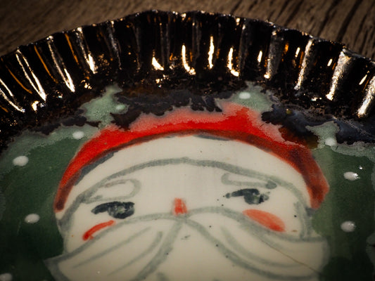 An original Christmas Holiday cake dinner dessert plate round glazed ceramic dinnerware handmade by Idania Salcido, the artist behind Danita Art. Glazed carved sgraffito stoneware, hand painted and decorated, it is illustrated by hand with snowmen, Christmas trees, Santa Claus, angels and snowballs and winter themes.