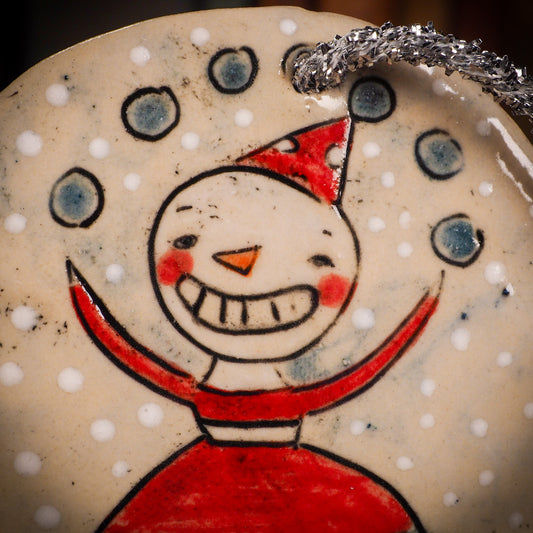 An original Christmas Holiday tree round glazed ceramic ornament handmade by Idania Salcido, the artist behind Danita Art. Glazed carved sgraffito stoneware, hand painted and decorated, it is illustrated by hand with winter scenes with snowmen, Christmas trees, Santa Claus, snow balls and winter themes.