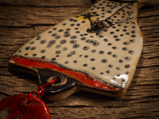 An original Christmas Holiday tree round glazed ceramic ornament handmade by Idania Salcido, the artist behind Danita Art. Glazed carved sgraffito stoneware, hand painted and decorated, it is illustrated by hand with snowmen, Christmas trees, Santa Claus, angels and snow balls and winter themes.