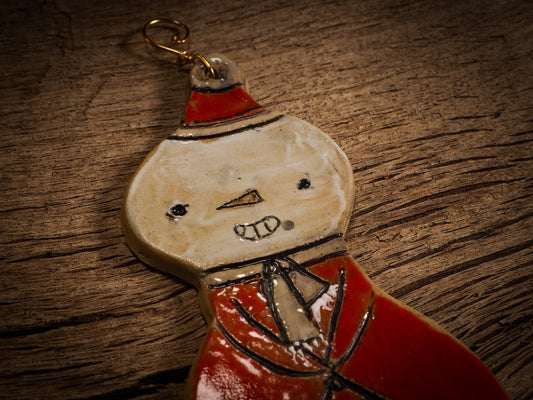 An original Christmas Holiday tree round glazed ceramic ornament handmade by Idania Salcido, the artist behind Danita Art. Glazed carved sgraffito stoneware, hand painted and decorated, it is illustrated by hand with snowmen, Christmas trees, Santa Claus, angels and snow balls and winter themes.