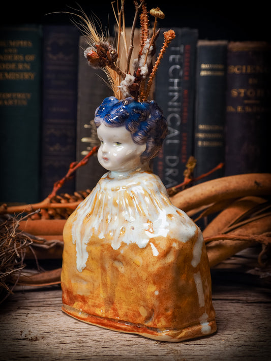 Original handmade ceramic flower vase, artist brush and pencil holder by Idania Salcido, Danita Art. A honeycomb bee shaped statue with china doll head. Handmade touch to any artist's studio with handmade glazed ceramic good for watercolors acrylics inks and oil paints. Clean with water or mineral spirits.