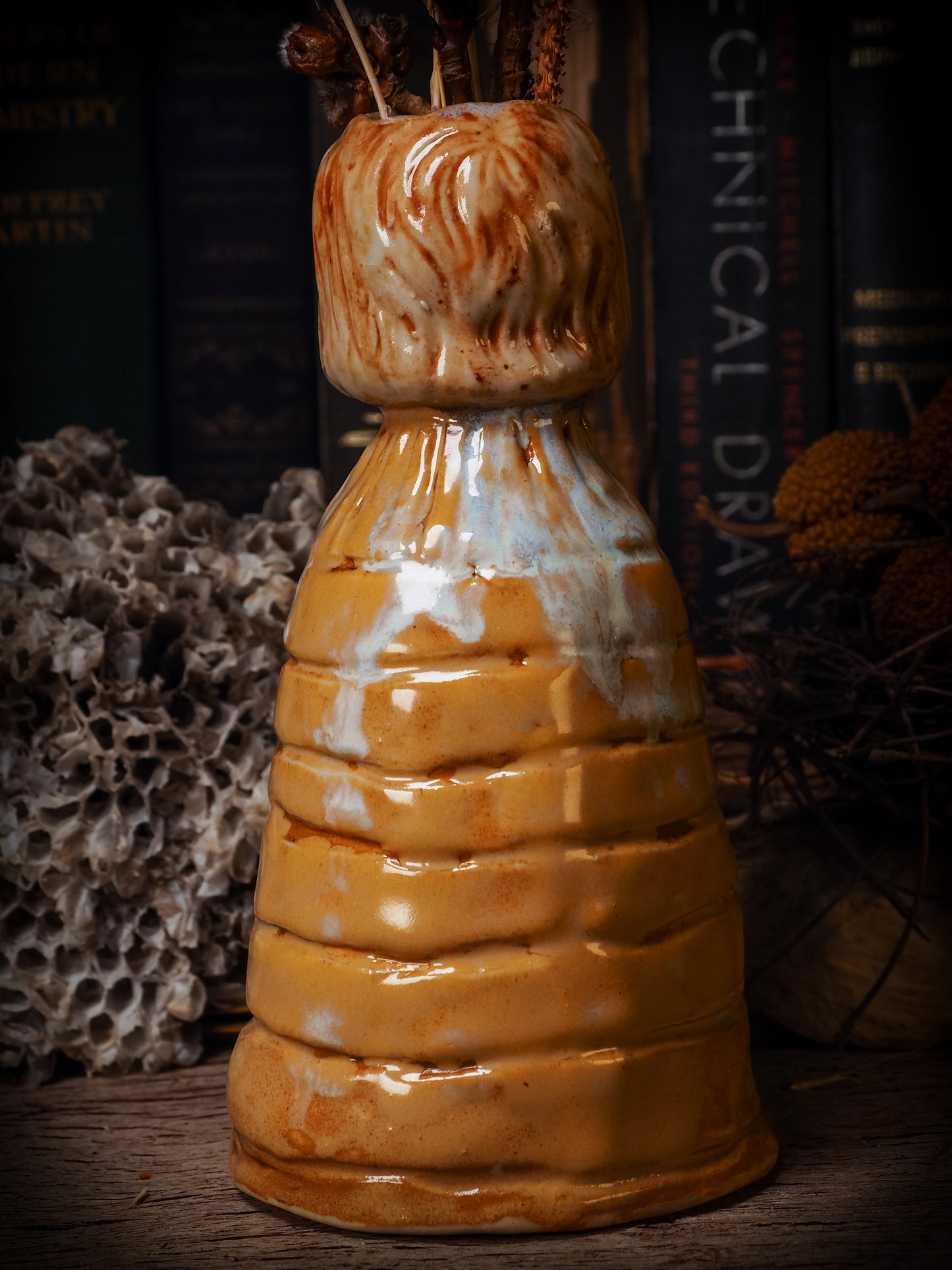 Original handmade ceramic flower vase, artist brush and pencil holder by Idania Salcido, Danita Art. A honeycomb bee shaped statue with china doll head. Handmade touch to any artist's studio with handmade glazed ceramic good for watercolors acrylics inks and oil paints. Clean with water or mineral spirits.