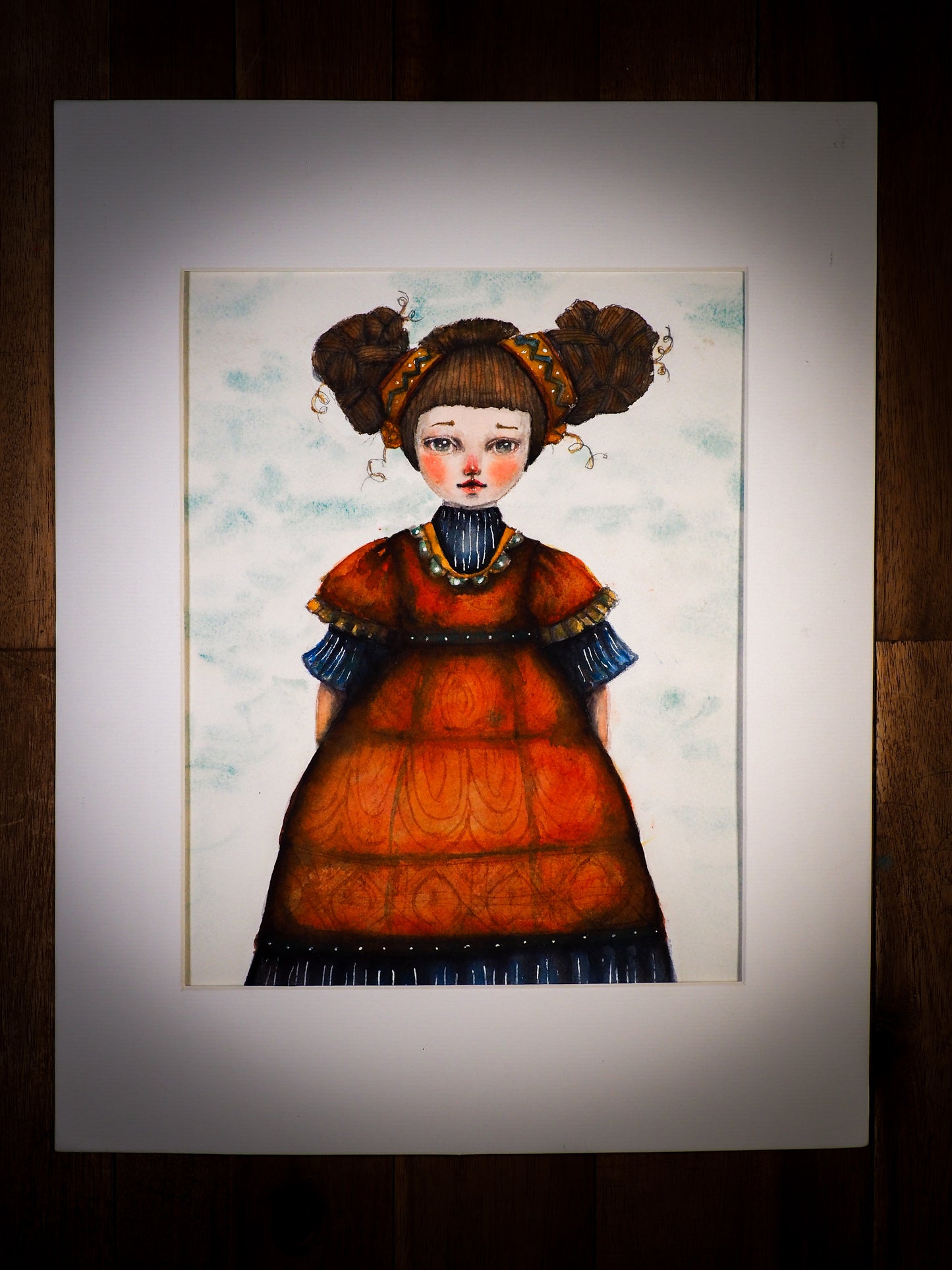 An original watercolor painting by Idania Salcido, the artist behind Danita Art. This is a beautiful mixed media painting, Frida Khalo wearing a high hairdo with beautiful hand painted red flowers in her hair. Painted in mixed media, acrylics, inks and pastels on special handmade paper.