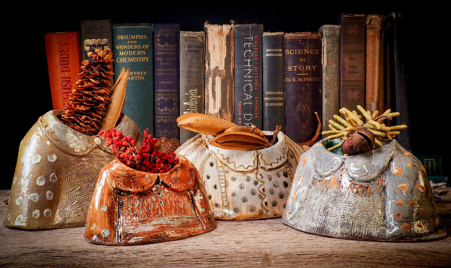 Using hand pinching techniques in of a kind fire glazed ceramics, Idania Salcido, the artist behind Danita Art, sculpted glazed ceramic clay vase containers and flower pots in the shape of vintage blouses. Beautiful accents for your dinner table, showcase or anywhere you want to remind you of family and love.