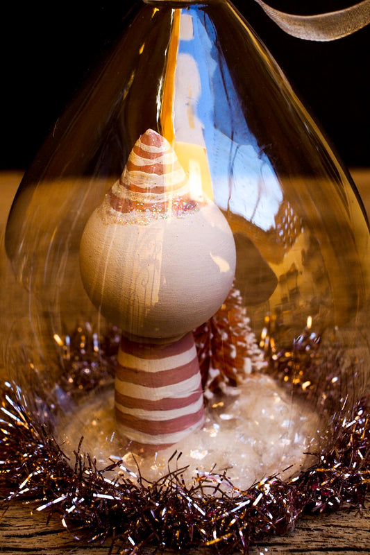 An original handmade christmas tree ornament by Idania Salcido. A clear domed diorama with a holiday scene with Santa Claus elves, Christmas Trees, Elves, Gifts and magical glitter deer. Perfect to decorate your Christmas Tree, your mantelpiece or to be used as accents on a dinner table.