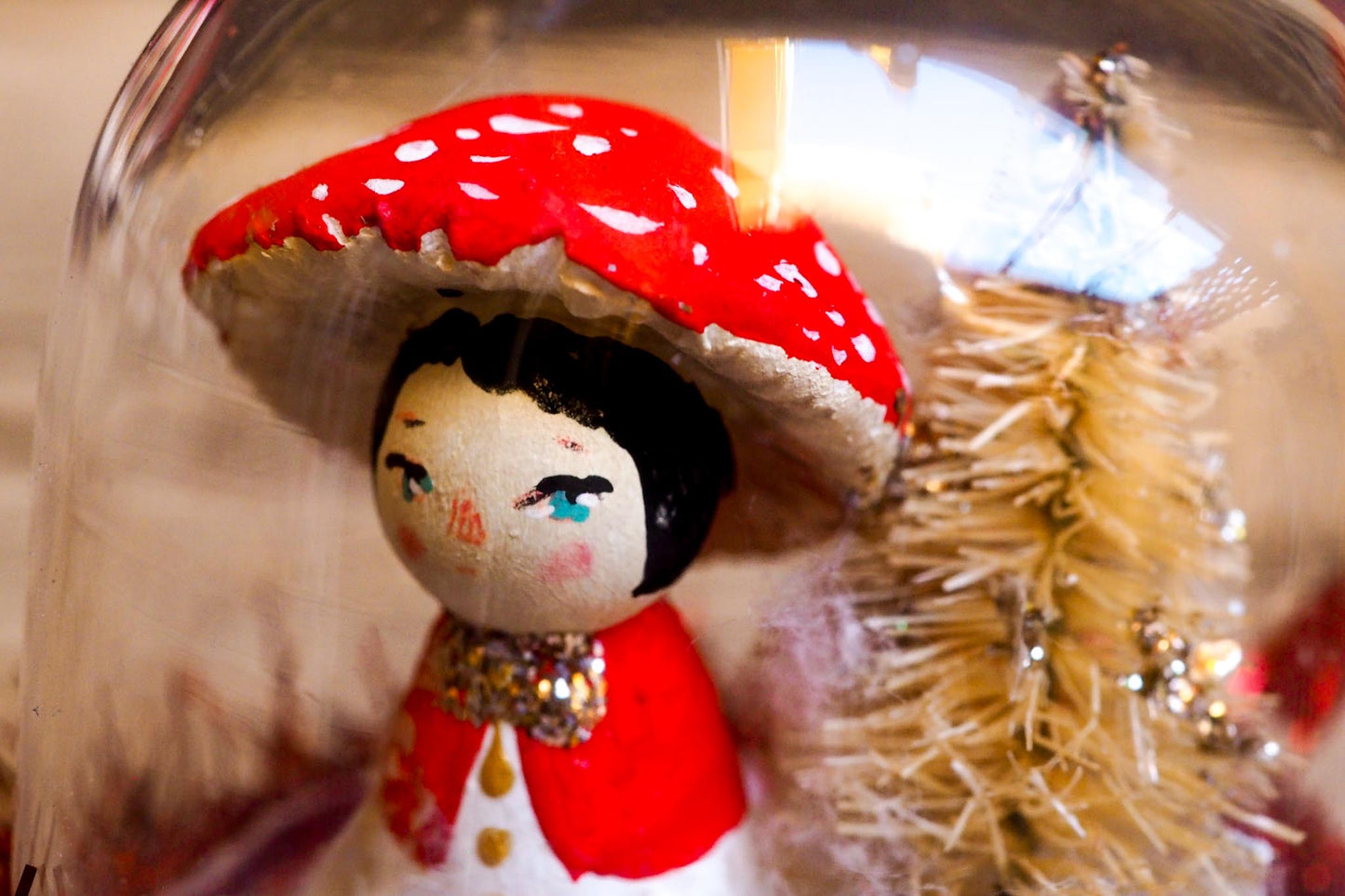 An original handmade christmas tree ornament by Idania Salcido. A clear domed diorama with a holiday scene with Santa Claus elves, Christmas Trees, Elves, Gifts and magical glitter deer. Perfect to decorate your Christmas Tree, your mantelpiece or to be used as accents on a dinner table.