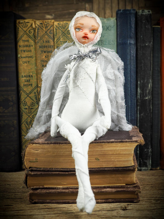 Each Danita Art angel doll is hand made, face sculpted in polymer clay and painted in oils. The fabric is tea-stained. The wings attached with a button so they can be moved up and down. I like my dolls to be poseable, so their arms and legs bend, you can pose them in a praying position, standing, sitting or kneeling. I can include a ribbon for hanging on request.