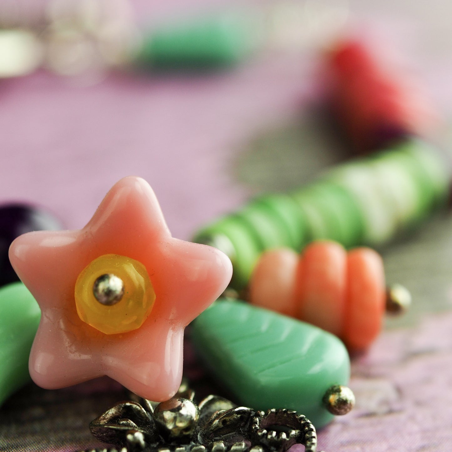 Two sisters enjoy the joy of baking in this original bracelet by Da its Art. Glass beads and jade make this colorful and beautiful piece of wearable art.