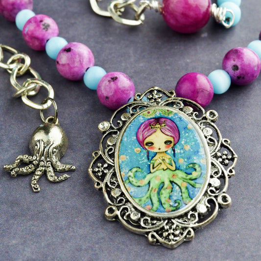 Octopus mermaid girl necklace by Danita. One of a kind jewelry with faceted glass beads.