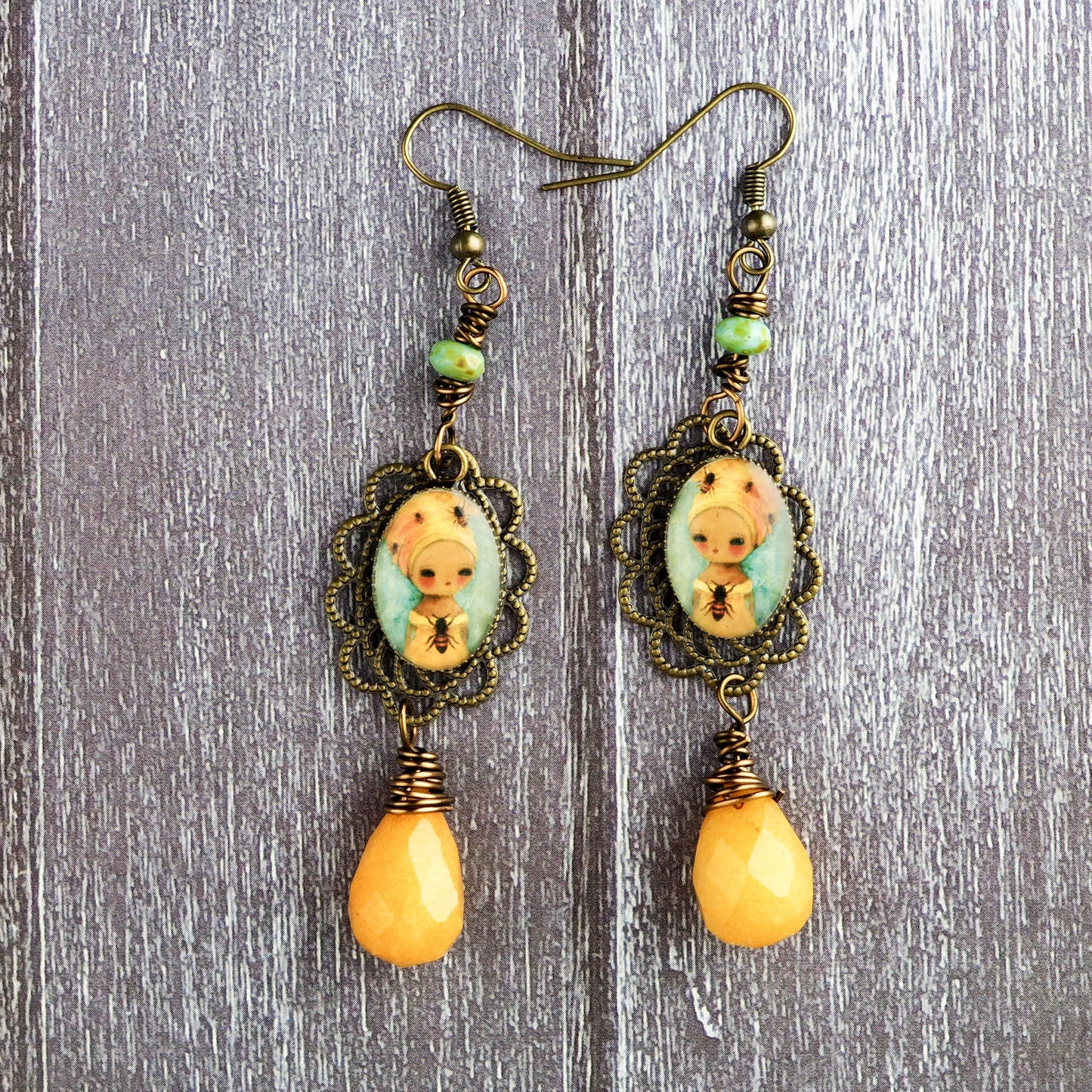 The queen bee. Original jewelry handmade by Danita with prints of original mixed media and watercolor paintings.