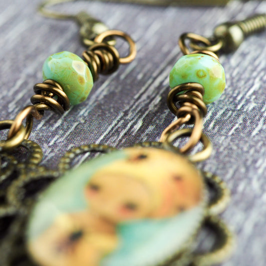 The queen bee. Original jewelry handmade by Danita with prints of original mixed media and watercolor paintings.