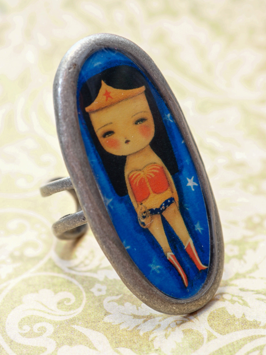 Wonder Woman empowers you with this amazing handmade ring made by Danita Art. It's the perfect accessory for any outfit for your own unique style.