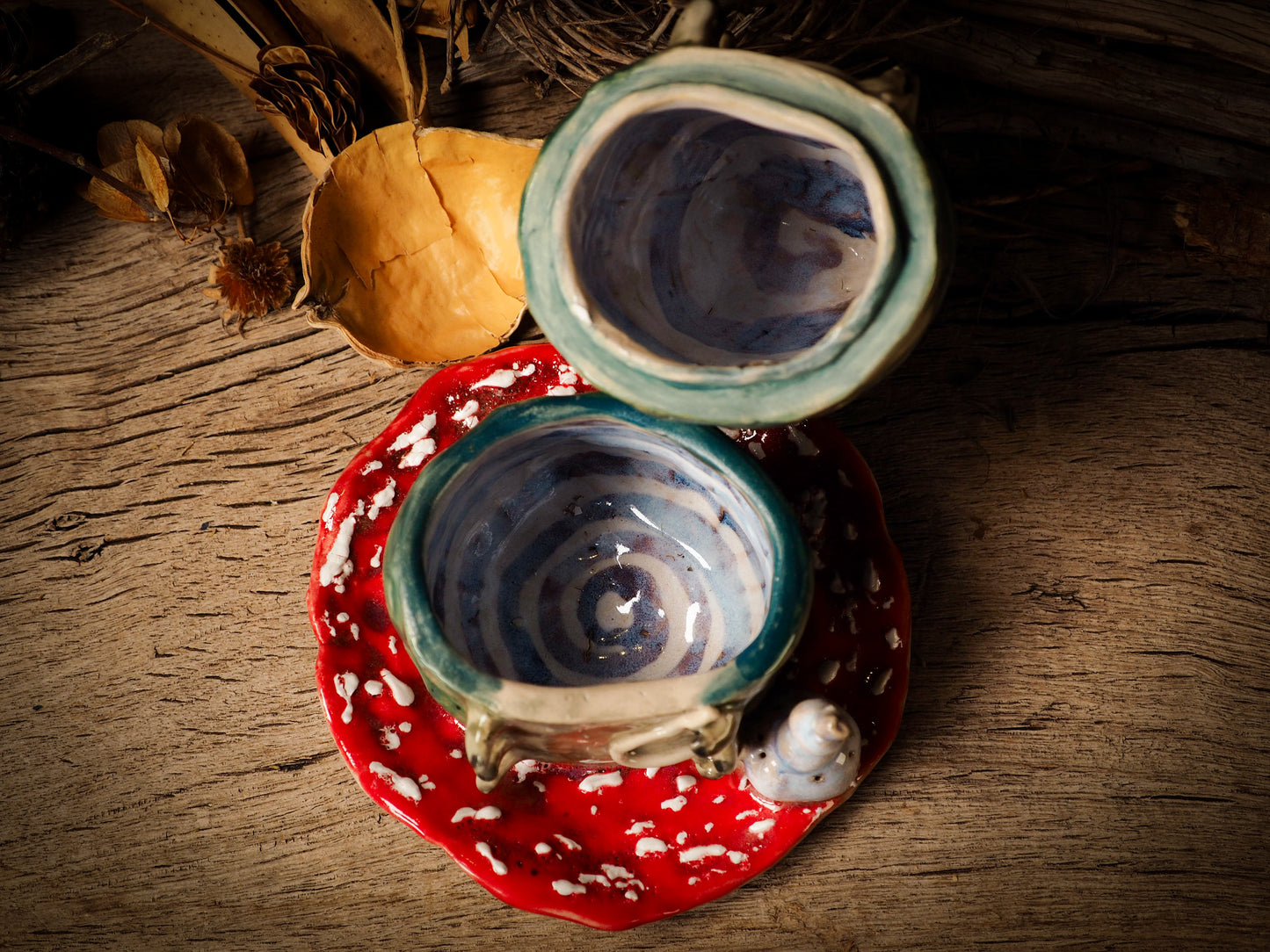 green caterpillar toadstool ceramic figure inspired by Alice in Wonderland made by Idania Salcido, the mixed media artist and ceramist behind Danita Art. Earth clay is hand sculpted and glazed and kiln fired to create a ceramic home decor heirloom figurine. Each unique art piece is a one of a kind fine pottery artwork.