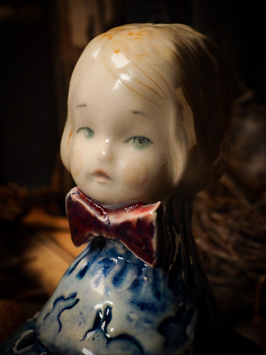 Flower pot vase with rabbit ceramic figure inspired by Alice in Wonderland made by Idania Salcido, the mixed media artist and ceramist behind Danita Art. Earth clay is hand sculpted and glazed and kiln fired to create a ceramic home decor heirloom figurine. Each unique art piece is a one of a kind fine pottery artwork.