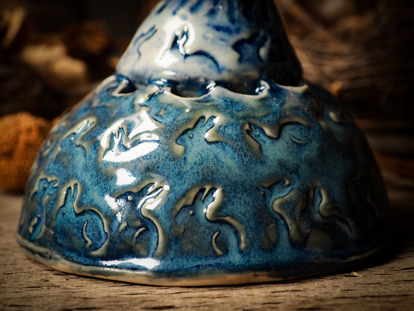 Flower pot vase with rabbit ceramic figure inspired by Alice in Wonderland made by Idania Salcido, the mixed media artist and ceramist behind Danita Art. Earth clay is hand sculpted and glazed and kiln fired to create a ceramic home decor heirloom figurine. Each unique art piece is a one of a kind fine pottery artwork.