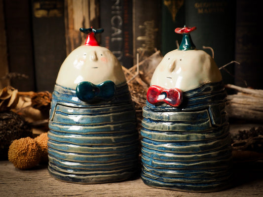 Tweedle Dee and Tweedle Dum ceramic figure inspired by Alice in Wonderland made by Idania Salcido, the mixed media artist and ceramist behind Danita Art. Earth clay is hand sculpted and glazed and kiln fired to create a ceramic home decor heirloom figurine. Each unique art piece is a one of a kind fine pottery artwork.