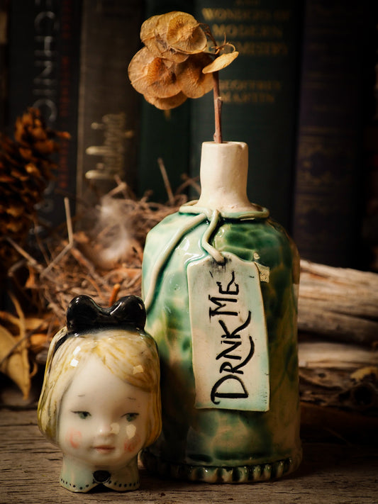 Flower pot container ceramic figure inspired by Alice in Wonderland made by Idania Salcido, the mixed media artist and ceramist behind Danita Art. Earth clay is hand sculpted and glazed and kiln fired to create a ceramic home decor heirloom figurine. Each unique art piece is a one of a kind fine pottery artwork.