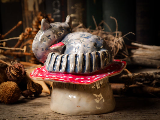 Cheshire Cat vintage pet ceramic figure inspired by Alice in Wonderland made by Idania Salcido, the mixed media artist and ceramist behind Danita Art. Earth clay is hand sculpted and glazed and kiln fired to create a ceramic home decor heirloom figurine. Each unique art piece is a one of a kind fine pottery artwork.