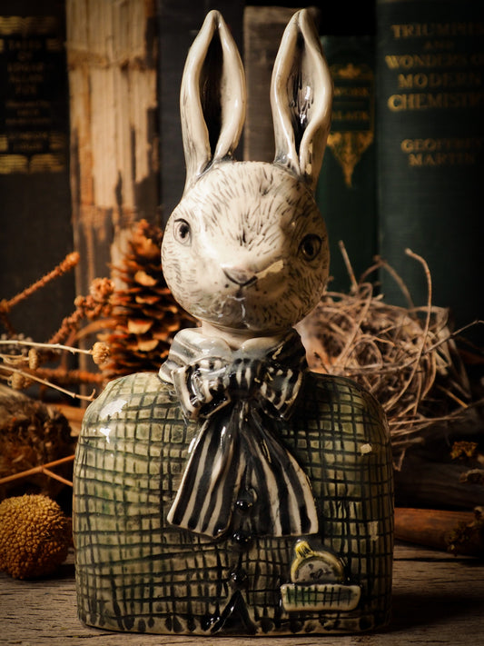 Alice the rabbit hare vintage ceramic figure inspired by Alice in Wonderland made by Idania Salcido, the mixed media artist ceramist behind Danita Art. Earth clay is hand sculpted and glazed and kiln fired to create a ceramic home decor heirloom figurine. Each unique art piece is a one of a kind fine pottery artwork.