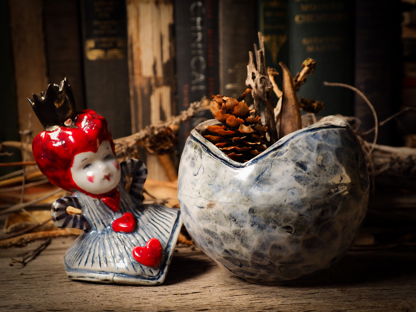 Red Queen hearts vintage ceramic figure inspired by Alice in Wonderland made by Idania Salcido, the mixed media artist and ceramist behind Danita Art. Earth clay is hand sculpted and glazed and kiln fired to create a ceramic home decor heirloom figurine. Each unique art piece is a one of a kind fine pottery artwork.