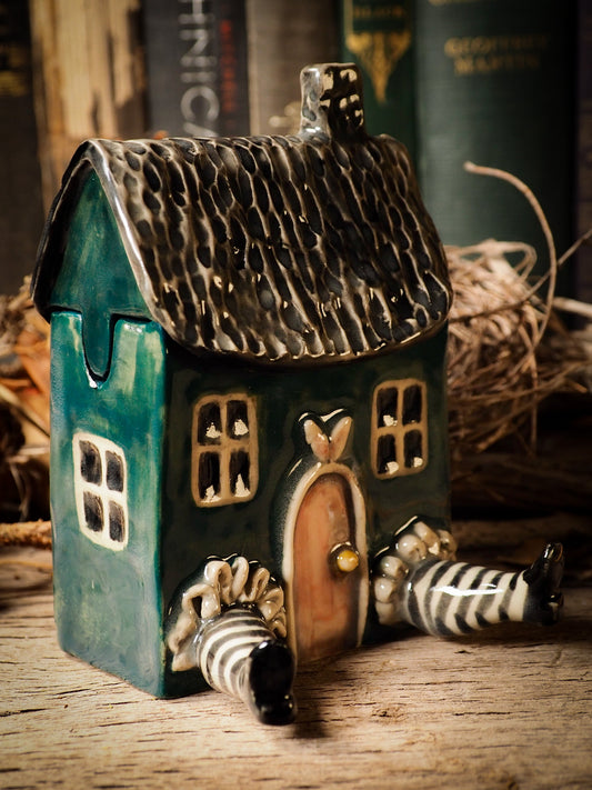 White Rabbit House Alice ceramic figure inspired by Alice in Wonderland made by Idania Salcido, the mixed media artist and ceramist behind Danita Art. Earth clay is hand sculpted and glazed and kiln fired to create a ceramic home decor heirloom figurine. Each unique art piece is a one of a kind fine pottery artwork.