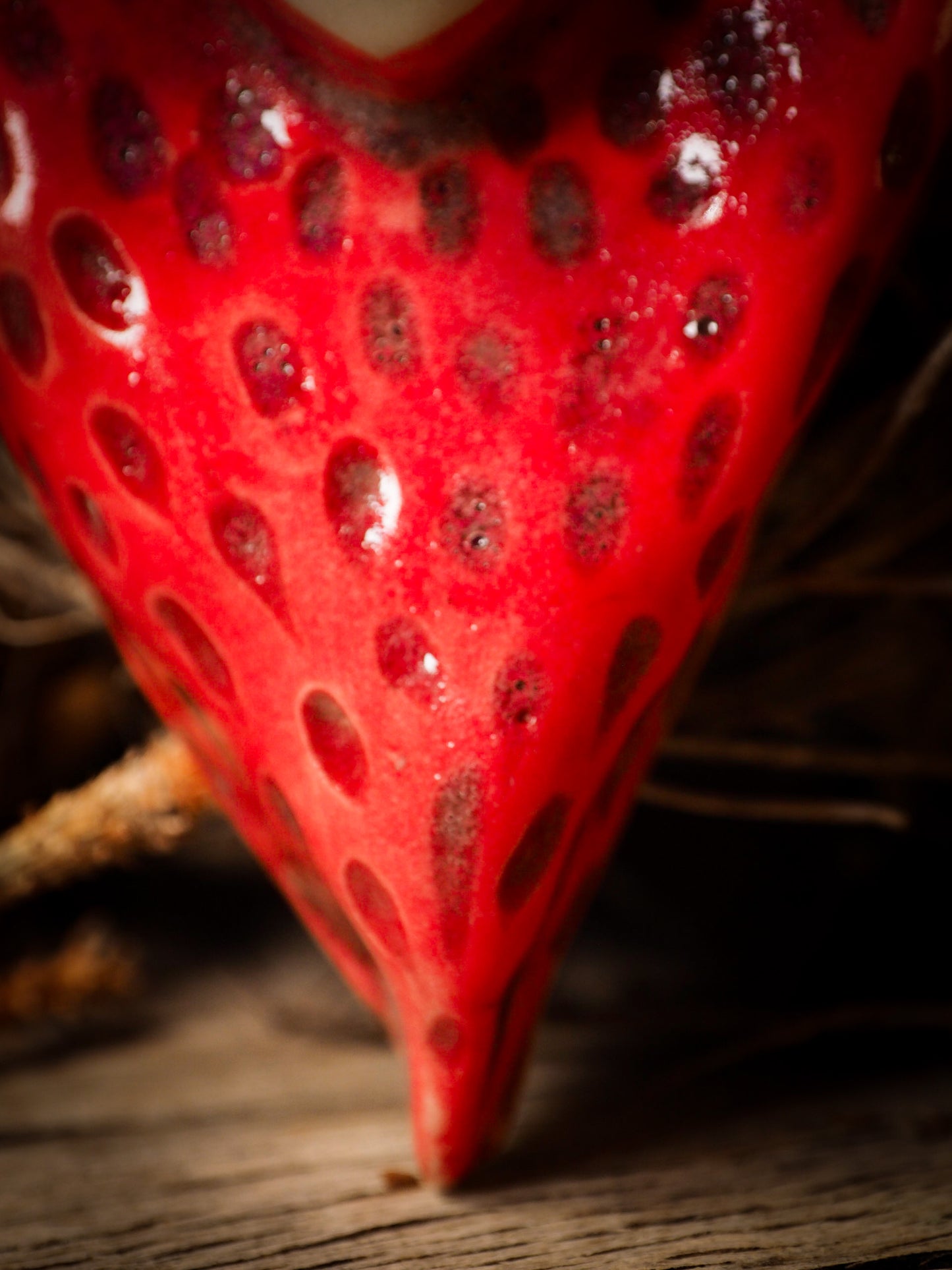 red burning heart glazed ceramic torso figure inspired by Alice in Wonderland by Idania Salcido, the artist behind Danita Art. Lumps of clay hand sculpted and glazed are kiln fired. Beautiful heart shaped wall hangings with nail hole in the back to place on wall with a hook or display on shelf or showcase.