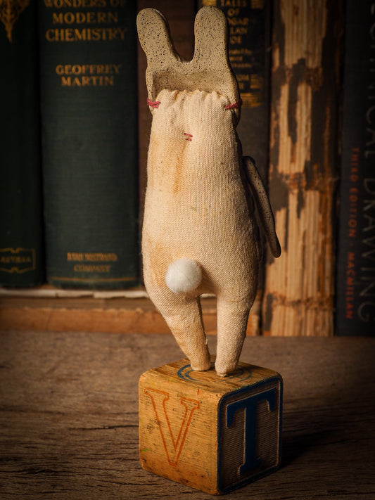 An adorable hand made porcelain and fabric fine art doll by Idania Salcido Danita Art. Perfect to hang as a delicate Christmas tree ornament, this fired ceramic mixed media artwork is unique. Each doll has a beautiful hand sculpted porcelain ceramic face and hand dyed fabric body with vintage accessories as home decor.