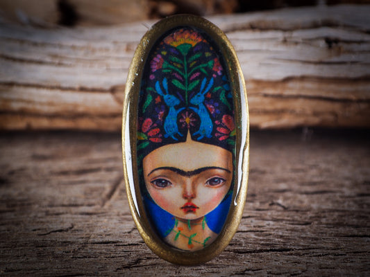 An original, one of a kind handmade jewelry by Idania Salcido, the artist behind Danita Art. Adjustable ring to different finger sizes, the oval image will create a statement of boldness and confidence that will draw looks and attention to your hands when you wear this powerful little piece with one of my favorite image.