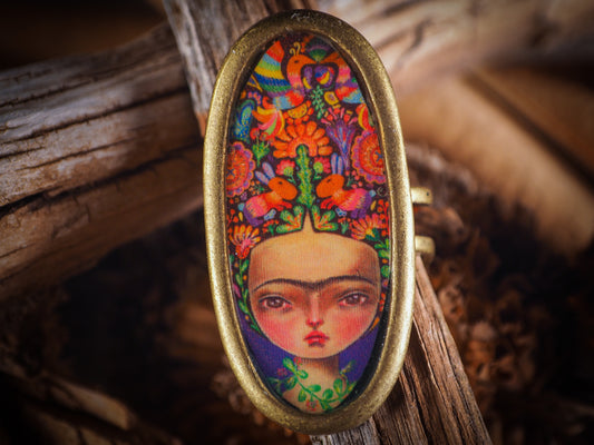 An original, one of a kind handmade jewelry by Idania Salcido, the artist behind Danita Art. Adjustable ring to different finger sizes, the oval image will create a statement of boldness and confidence that will draw looks and attention to your hands when you wear this powerful little piece with one of my favorite image.