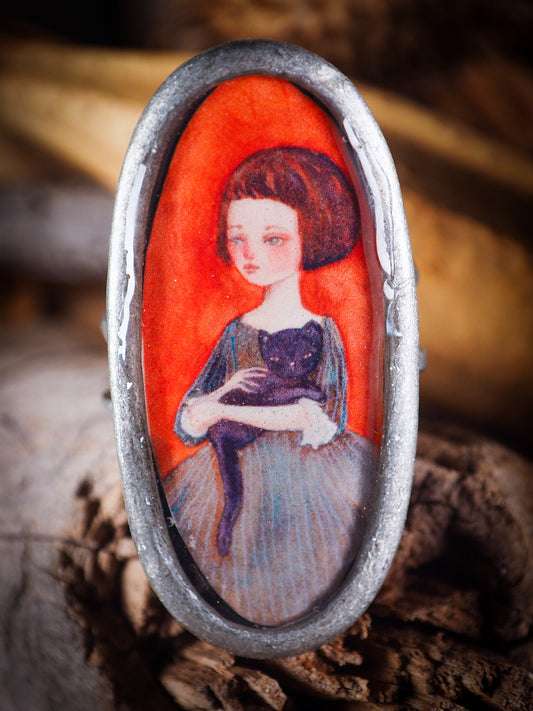 An original, one of a kind handmade jewelry by Idania Salcido, the artist behind Danita Art. Adjustable ring to different finger sizes, the oval image will create a statement of boldness and confidence that will draw looks and attention to your hands when you wear this powerful little piece with one of my favorite image.