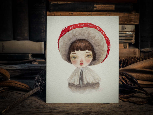 This series of original watercolors portraits by me, Idania Salcido, the artist behind Danita Art, depicts a group of faeries, or maybe girls, playing as mushrooms, with their caps as hats, my signature beautiful and expressive eyes, and capes as their clothes. They are ready to be framed as soon as they arrive!