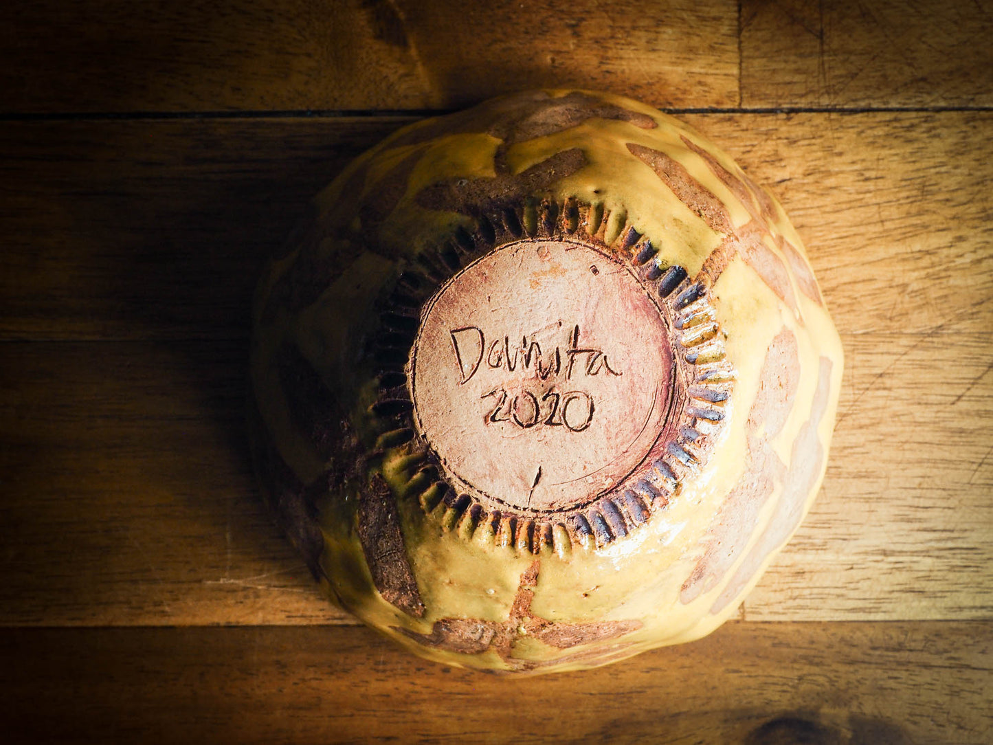 Original fired earthenware ceramic hand pinched bowl with yellow and brown flowers glazed and hand painted motif by Idania Salcido, the artist behind danita Art.