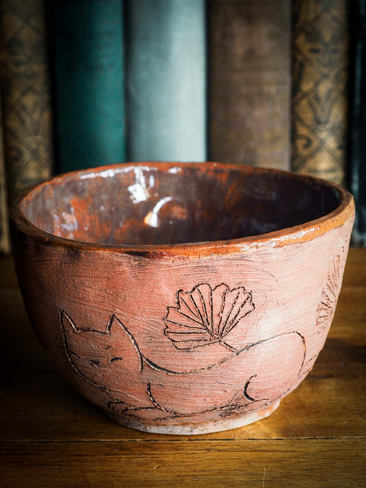 An original Idania Salcido Danita Art pinched ceramic cat pet food bowl. Handmade from locally foraged clay, this glazed ceramics one of a kind artwork is perfect for any kitchen plate and bowls unique collection. Thumbprints and intentionally irregular shape give the bowl a cozy, warmly familiar feel when you pick it.