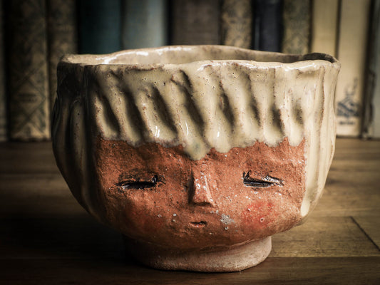 An original Idania Salcido Danita Art pinched ceramic cat pet food bowl. Handmade from locally foraged clay, this glazed ceramics one of a kind artwork is perfect for any kitchen plate and bowls unique collection. Thumbprints and intentionally irregular shape give the bowl a cozy, warmly familiar feel when you pick it. This bowl has one of Danita'sa famous painting and doll faces on it. Perfect for your home!