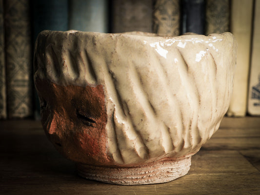 An original Idania Salcido Danita Art pinched ceramic cat pet food bowl. Handmade from locally foraged clay, this glazed ceramics one of a kind artwork is perfect for any kitchen plate and bowls unique collection. Thumbprints and intentionally irregular shape give the bowl a cozy, warmly familiar feel when you pick it. An adorable face like the ones Danita paints and makes dolls with is featured!